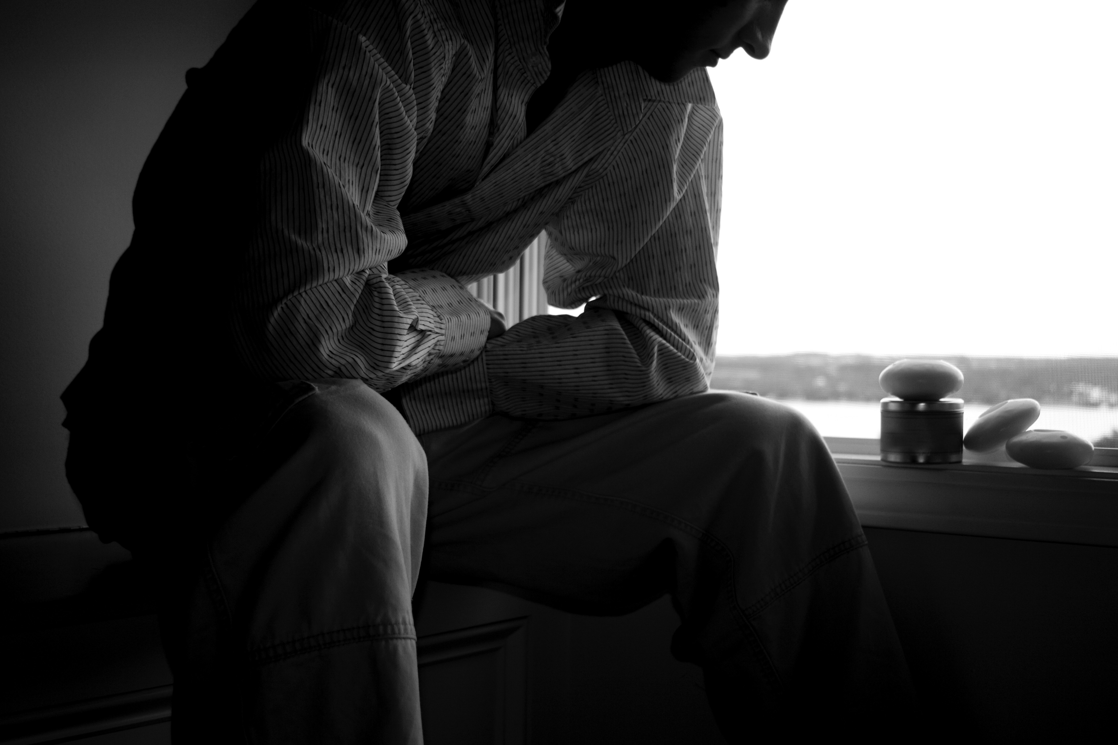 man-at-window-thinking